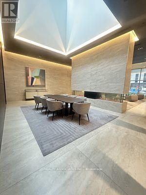 A conference room with a long table and chairs.