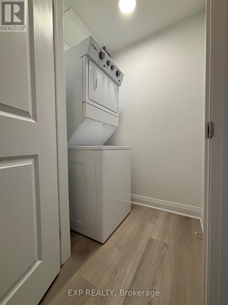 A white oven and dishwasher in a kitchen.