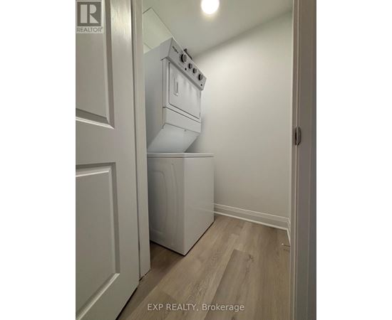 A white oven and dishwasher in a kitchen.