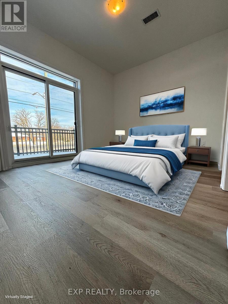 A bedroom with a large bed and a painting on the wall.