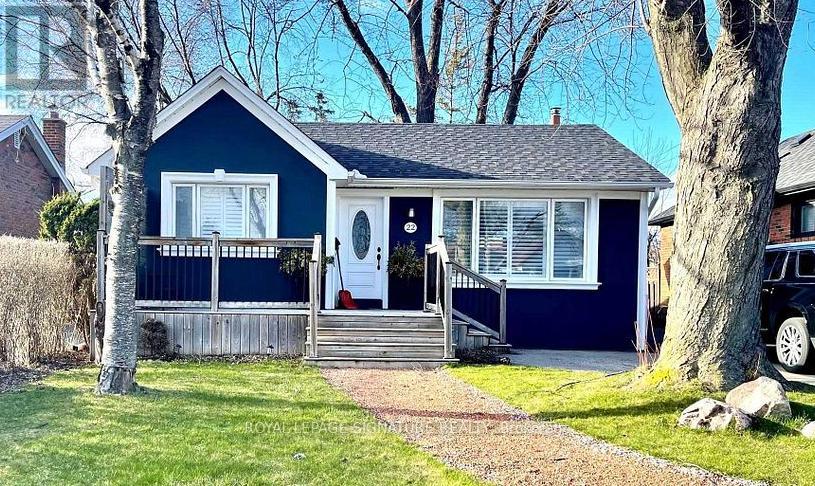 A blue house with a white door and windows.
