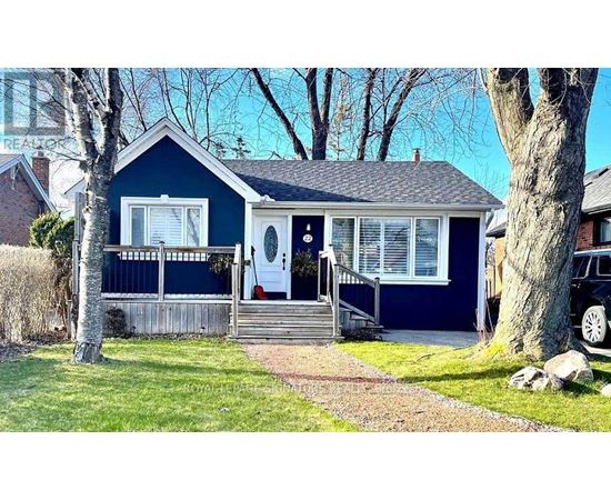 A blue house with a white door and windows.