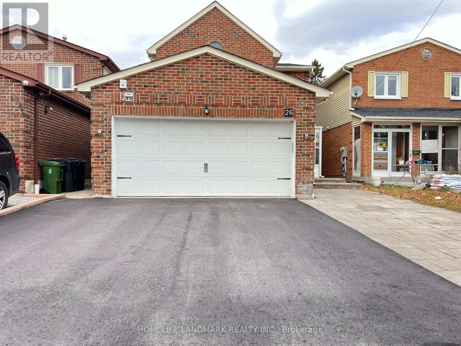 A house with a garage numbered 26.
