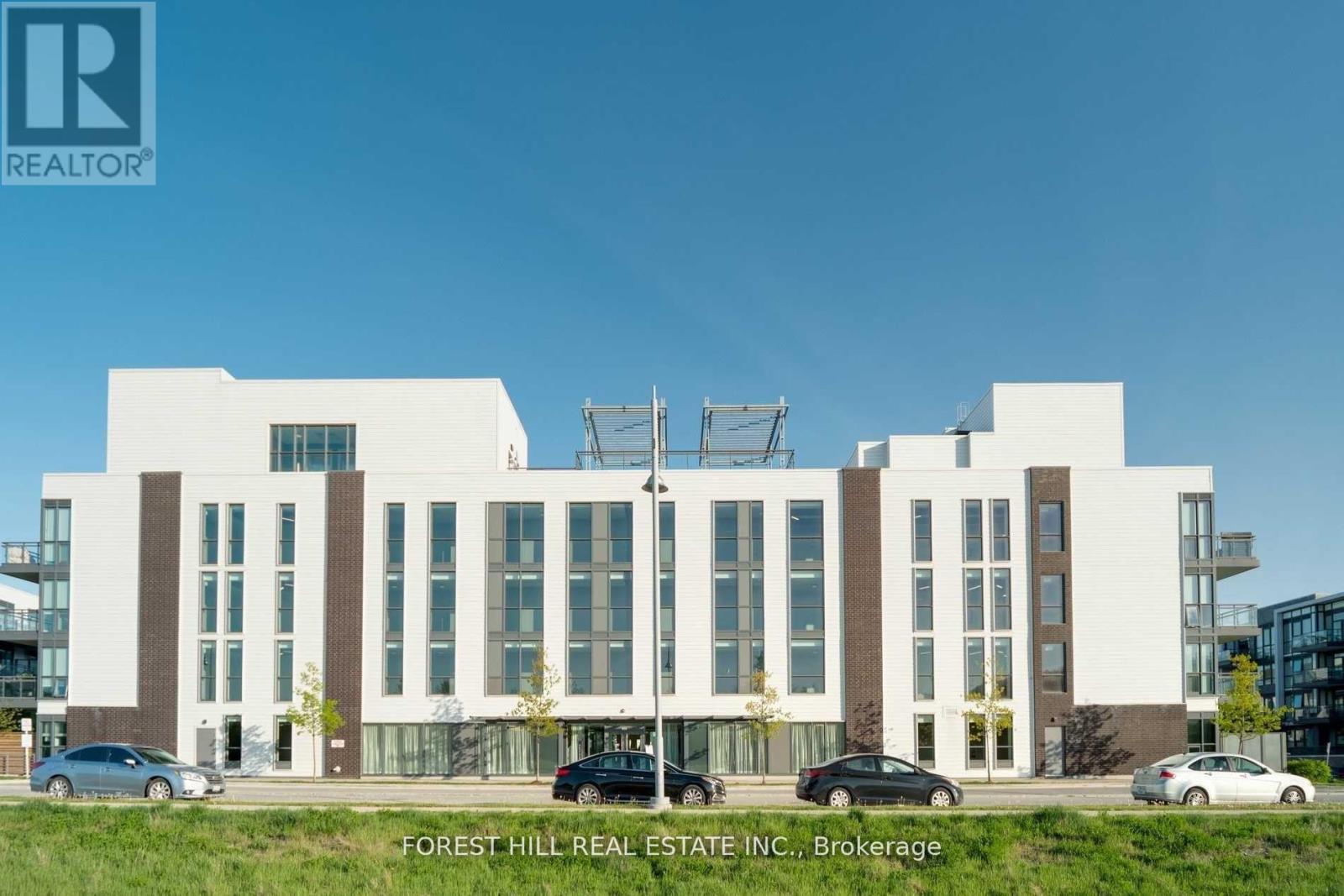 A modern building with the logo REALTOR on the top left corner.