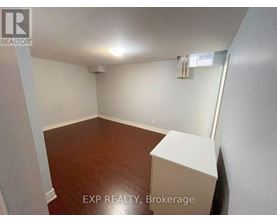 A room with EXP REALTY, Brokerage written on the bottom.