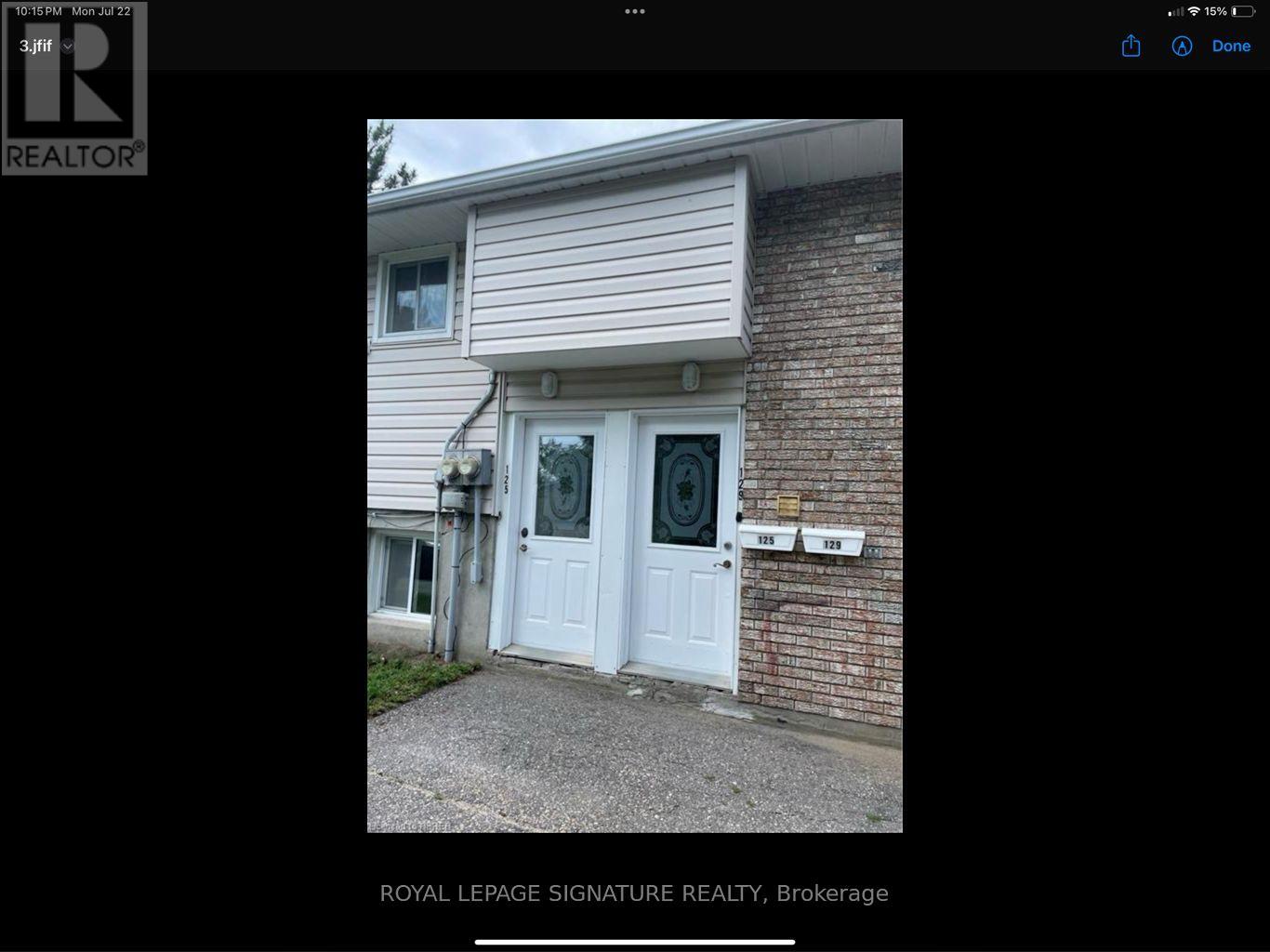 A white door is on the front of a house.
