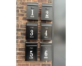A set of six mailboxes numbered from 1 to 6.