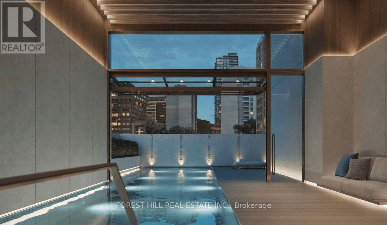 A modern interior with a pool and a view of the city.