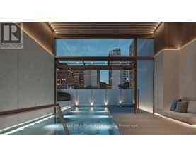 A modern interior with a pool and a view of the city.