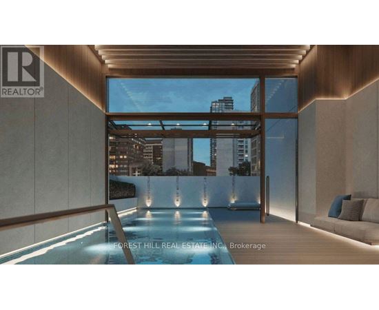 A modern interior with a pool and a view of the city.