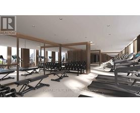 A gym with a row of treadmills and dumbbells.