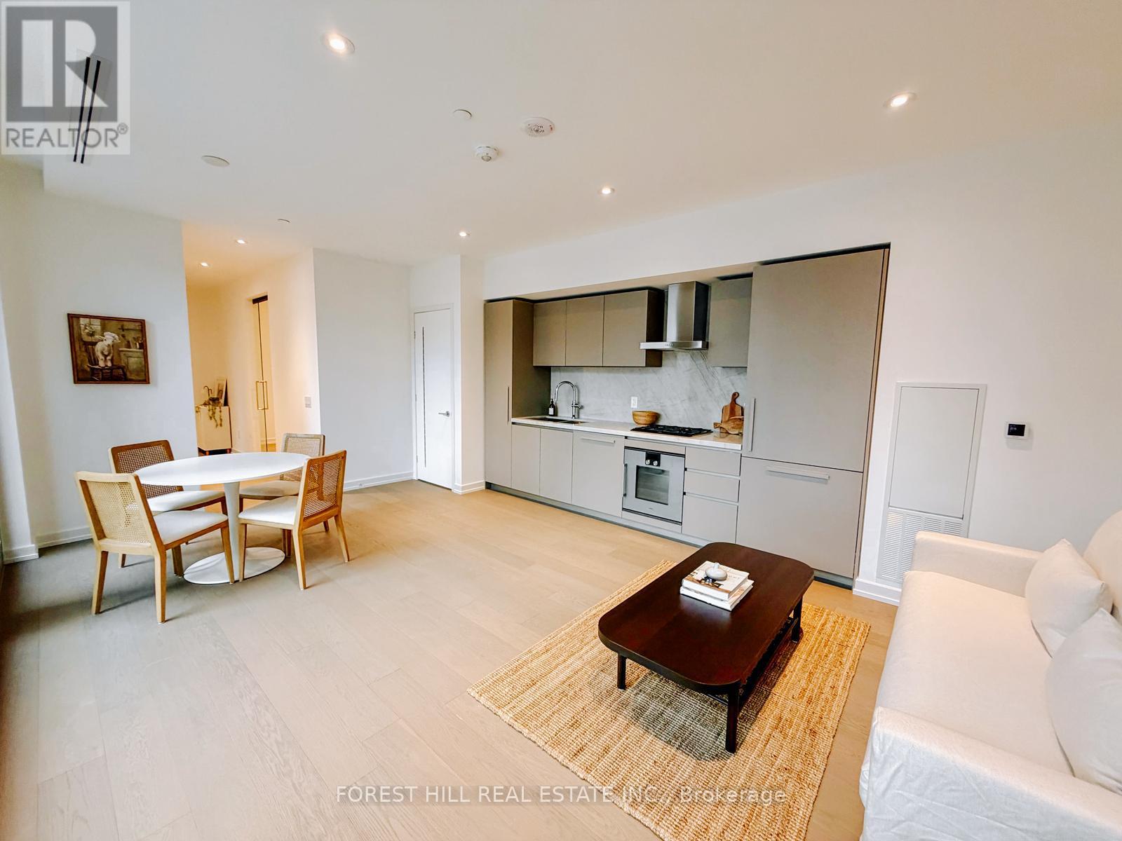 A modern living room with a dining table and a couch.