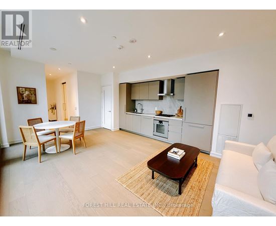 A modern living room with a dining table and a couch.