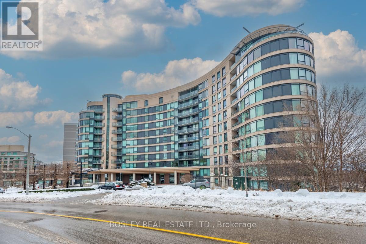 A modern building with a curved glass facade is the main focus of the image.