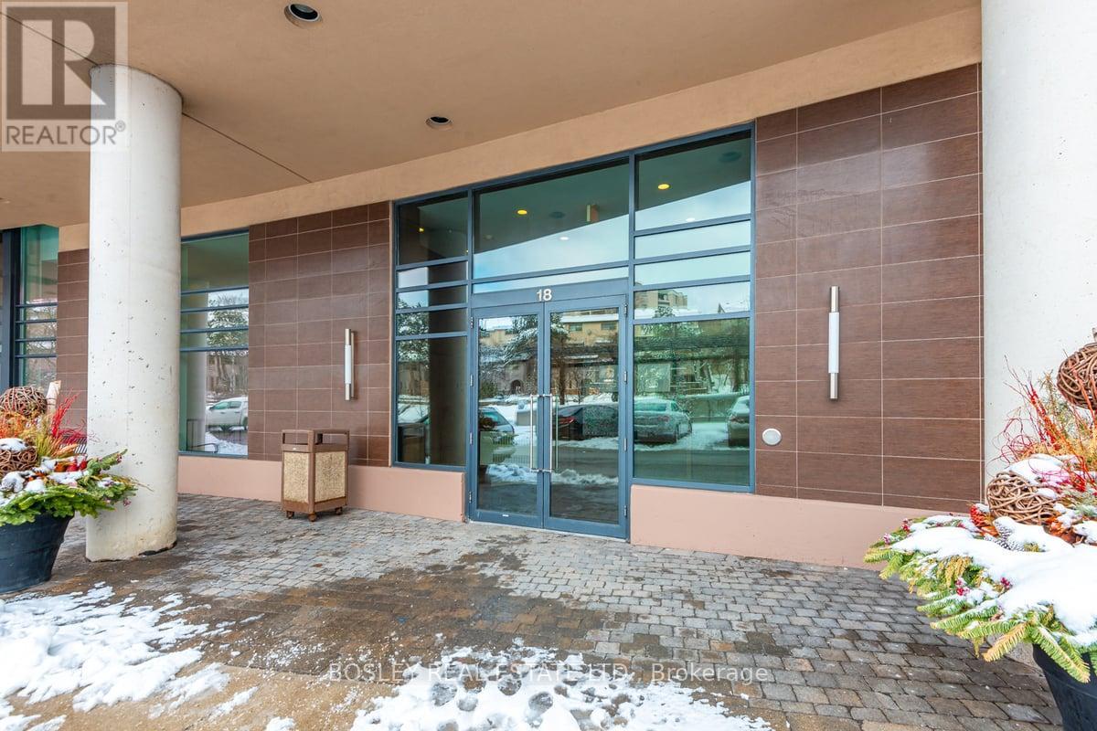 A building with a glass door entrance and a sign that says REALTOR.