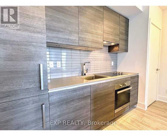 A modern kitchen with EXP Realty, Brokerage written on the wall.