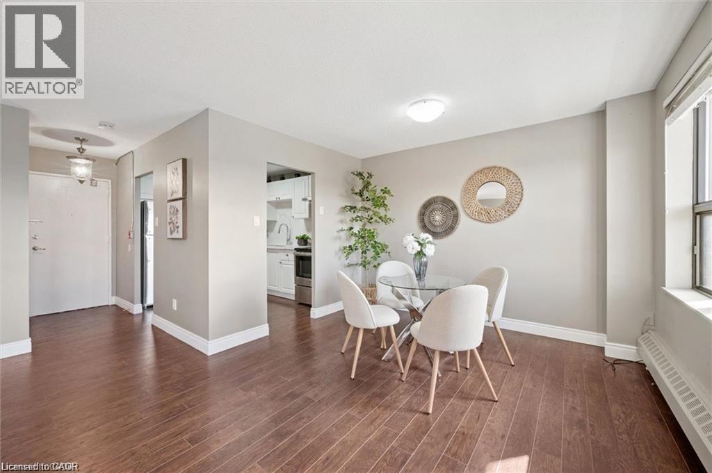 A dining room with a table and chairs.