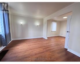 A room with wooden floors and white walls.