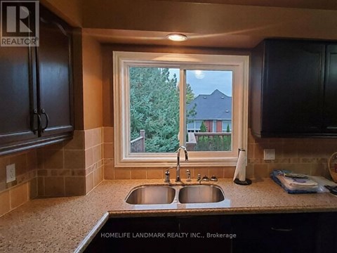 A kitchen with a sink and a window.