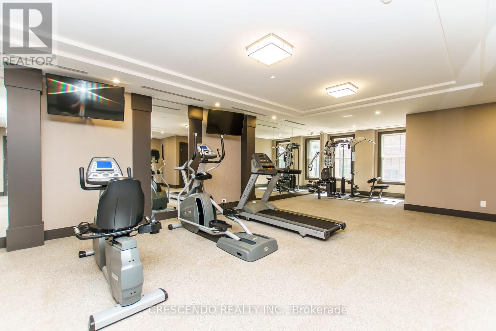 A spacious home gym with a variety of exercise equipment.