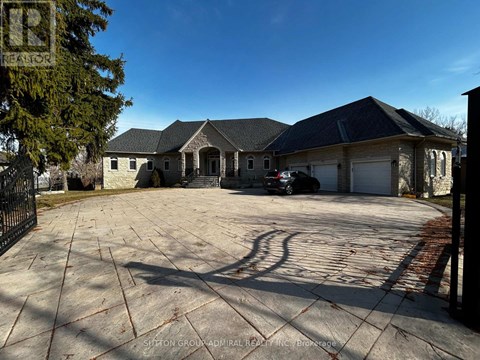 A large house with a driveway in front of it.