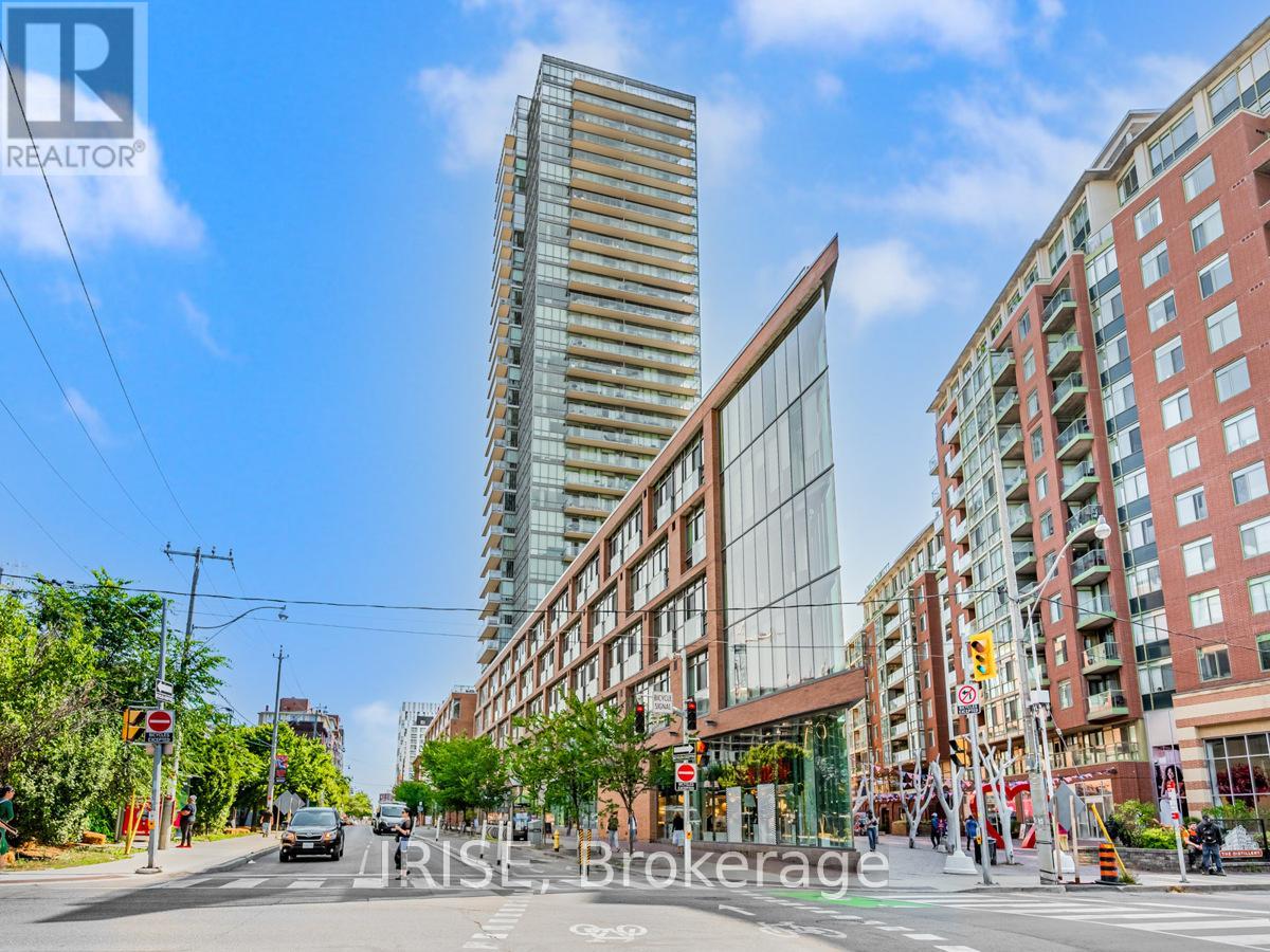 A street view of a city with a tall building in the background and a sign that reads "IRIS BROKERAGE".