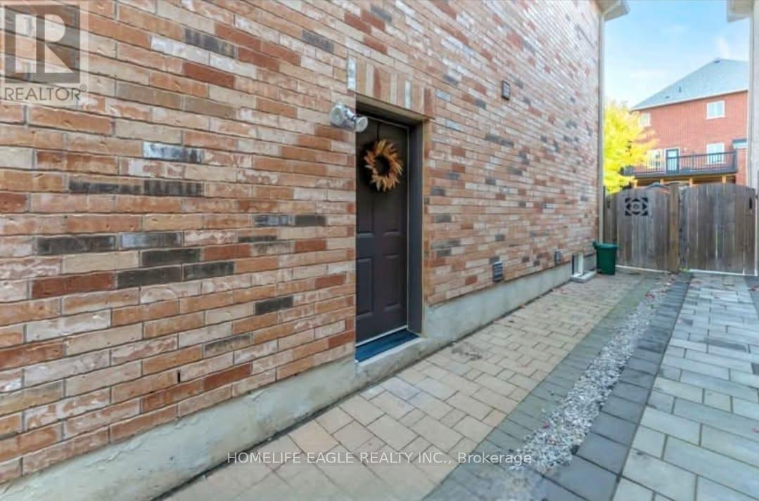 A brick wall with a door and a sign that says "REALTOR".