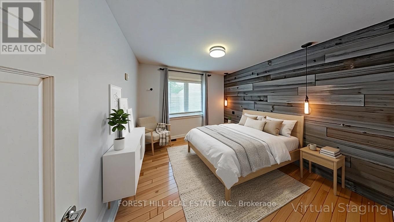 A bedroom with a bed, nightstand, and a wooden wall.
