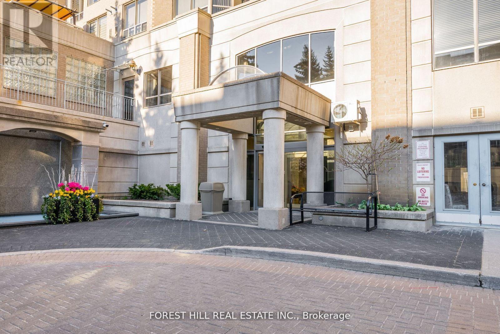 The front of a building with the words "Forest Hill Real Estate Inc., Brokerage" written on it.