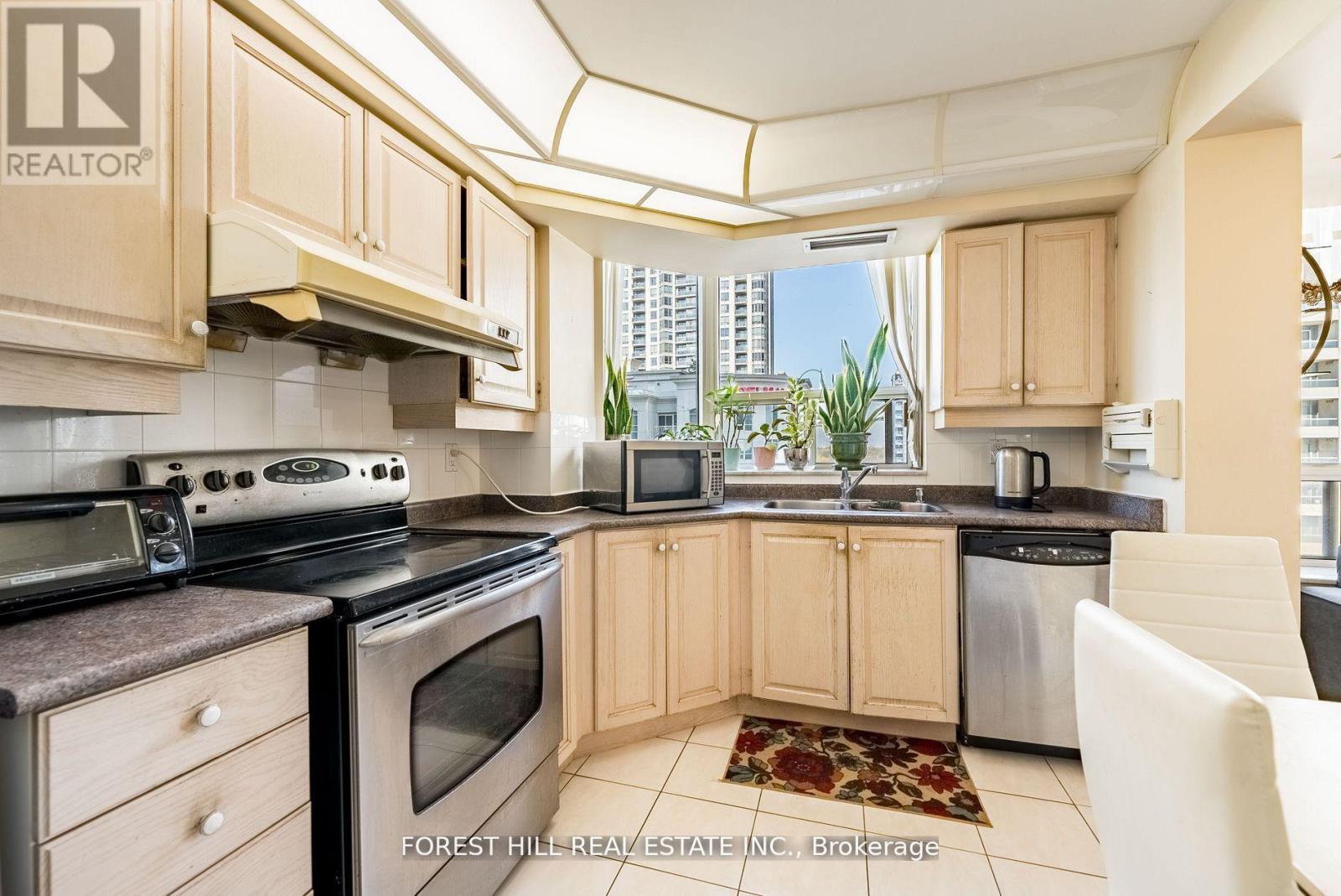 A kitchen with wooden cabinets and a stove top oven.