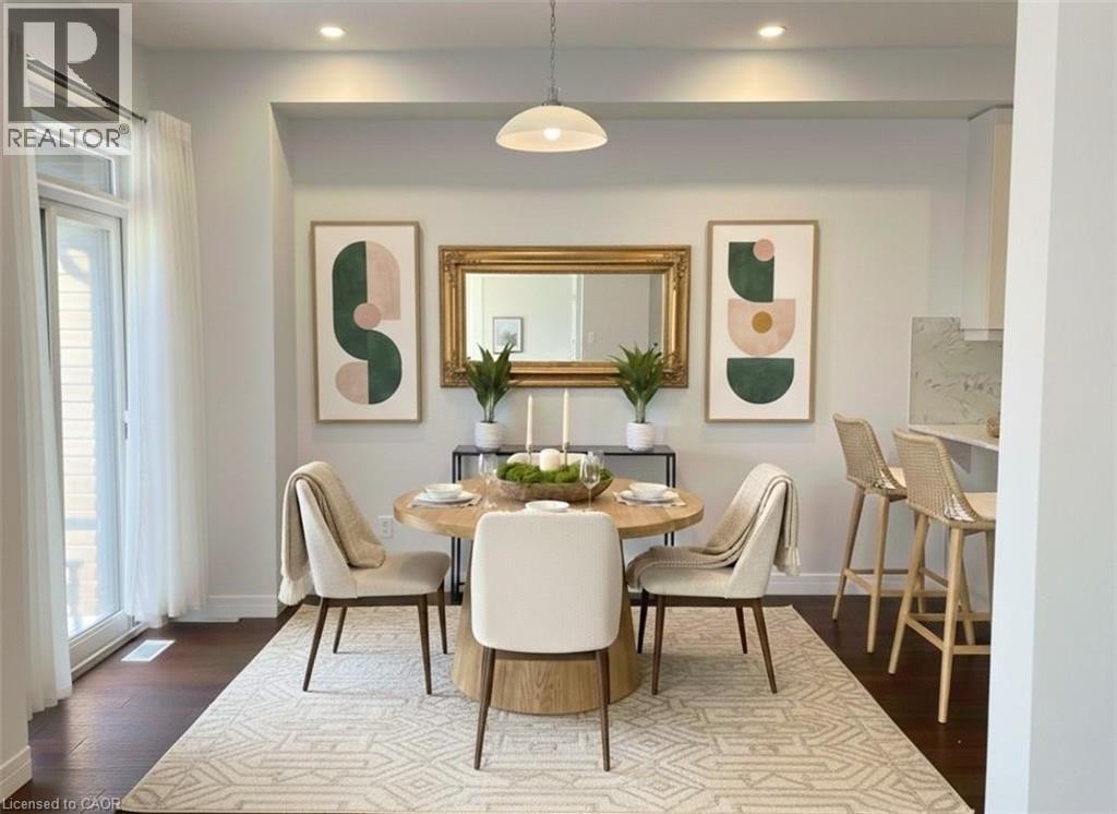 A dining room with a table set for four.