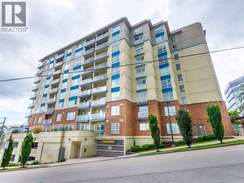 A large apartment building with a sign that says REALTOR.