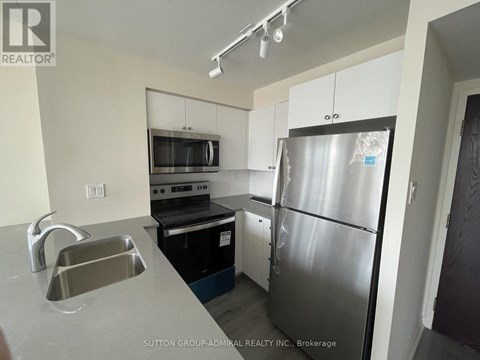 A kitchen with a stove top oven and microwave.