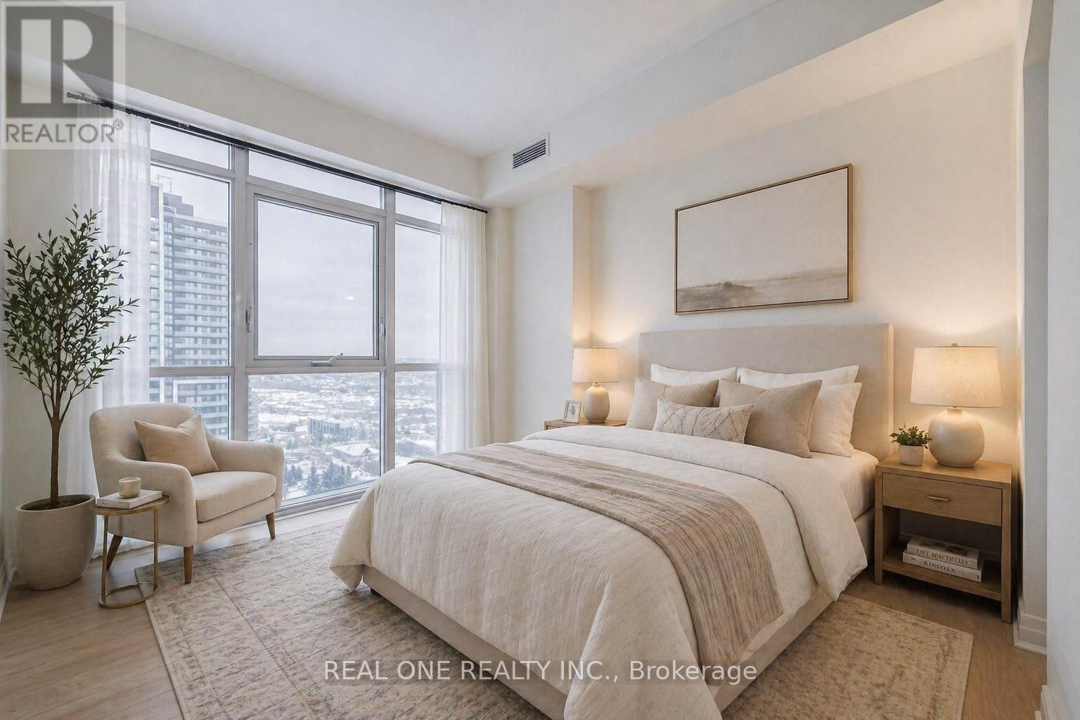 A bedroom with a large bed, nightstands, and a dresser.