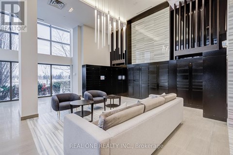 A modern living room with a large couch and a coffee table.