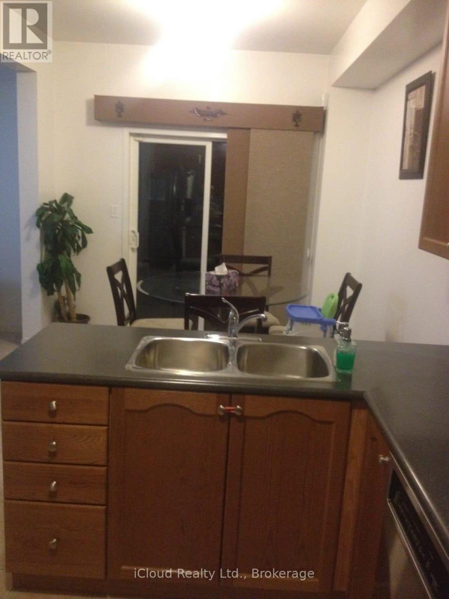A kitchen with a sink and a counter.