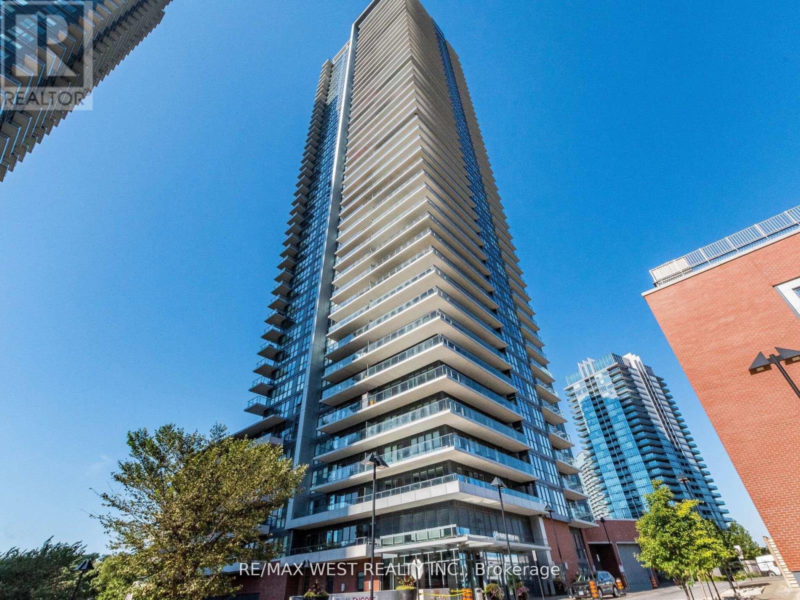 A tall building with a blue sky in the background.