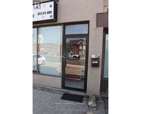 A building with a sign that says RE/MAX Premier.