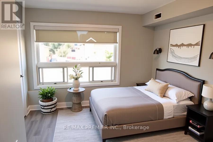 A bedroom with a large bed and a window with a view of the outside.