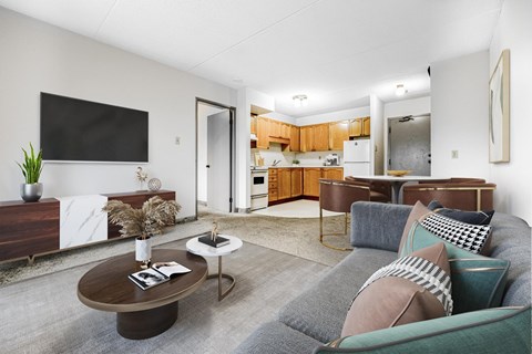 A living room with a grey couch and a coffee table.