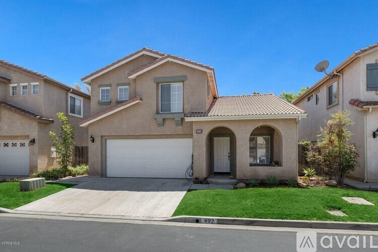 A house with a garage is for sale.