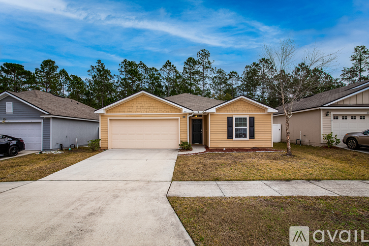 A house with a garage is available for sale.