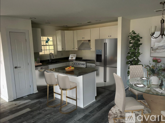 A modern kitchen with a glass table and chairs.