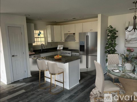 A modern kitchen with a glass table and chairs.