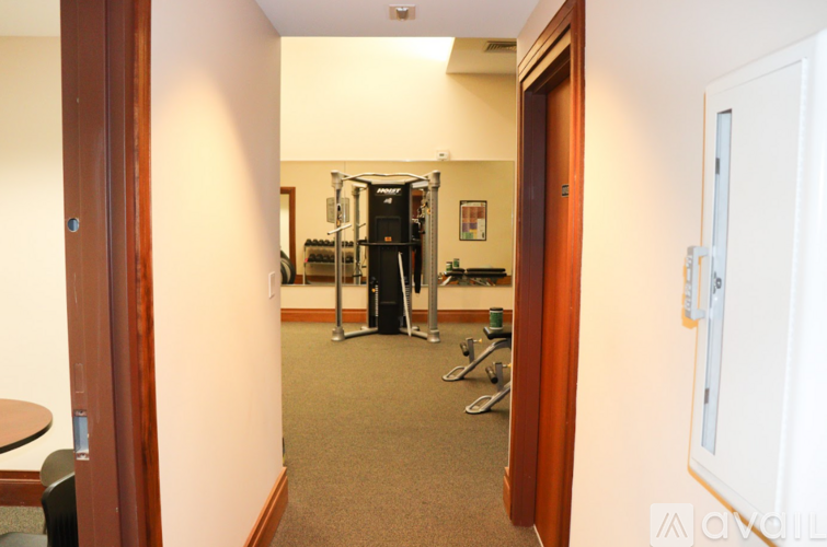 A room with a gym equipment set up in it.