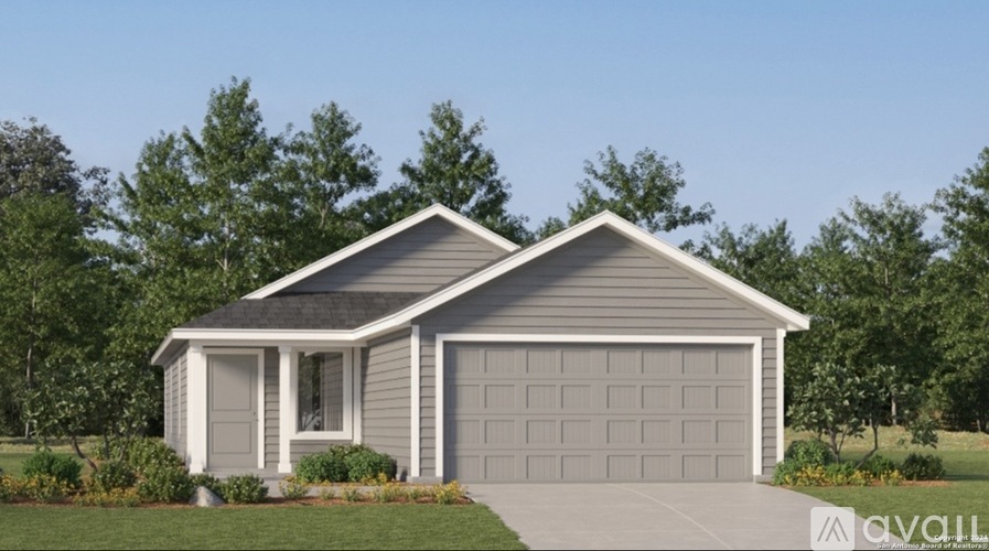 A two-car garage with a house in the background.