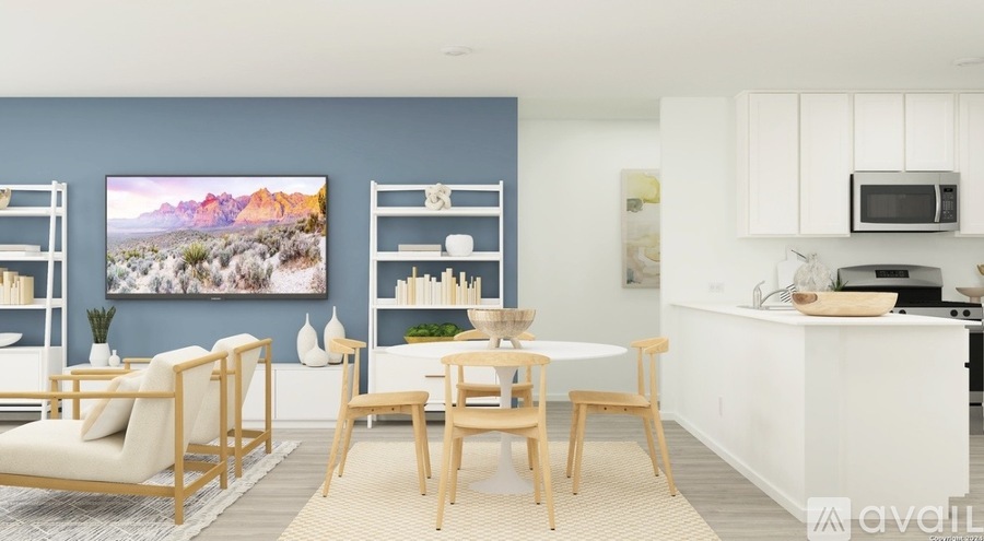 A modern kitchen with a dining table and chairs.