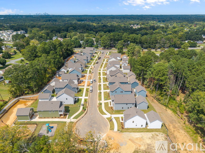 A bird's eye view of a residential area with houses and trees.