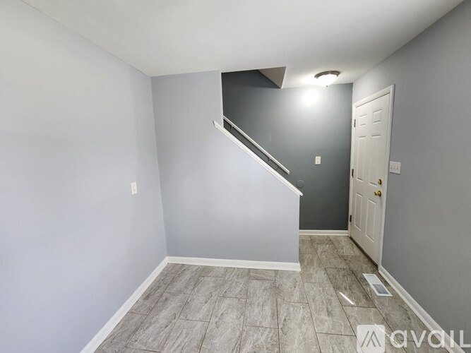 A room with a staircase leading to the next level.