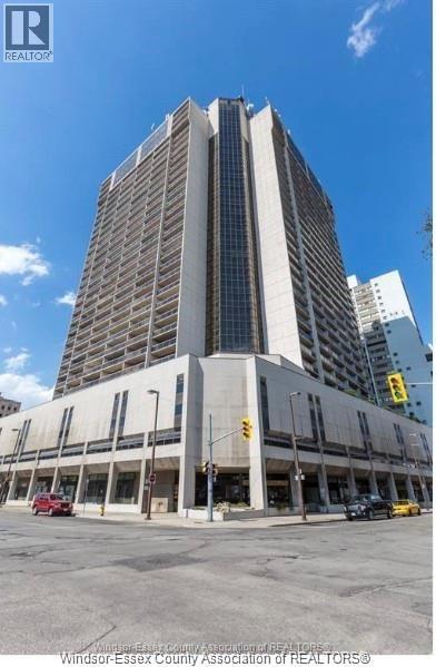 A large building with a glass facade is the main focus of the image.